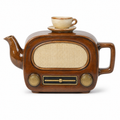 Radio Teapot: a ceramic 1950s valve radio in walnut brown with a cream speaker panel, brass knobs and a cup and saucer forming the lid