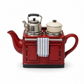 Range Cooker Teapot in red: a ceramic cast-iron range with a chrome kettle lid, a blue striped tea towel and a cream pot on the hob
